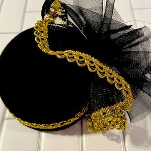 George Zamau’l wool hat. Black with decorative gold trim accents.